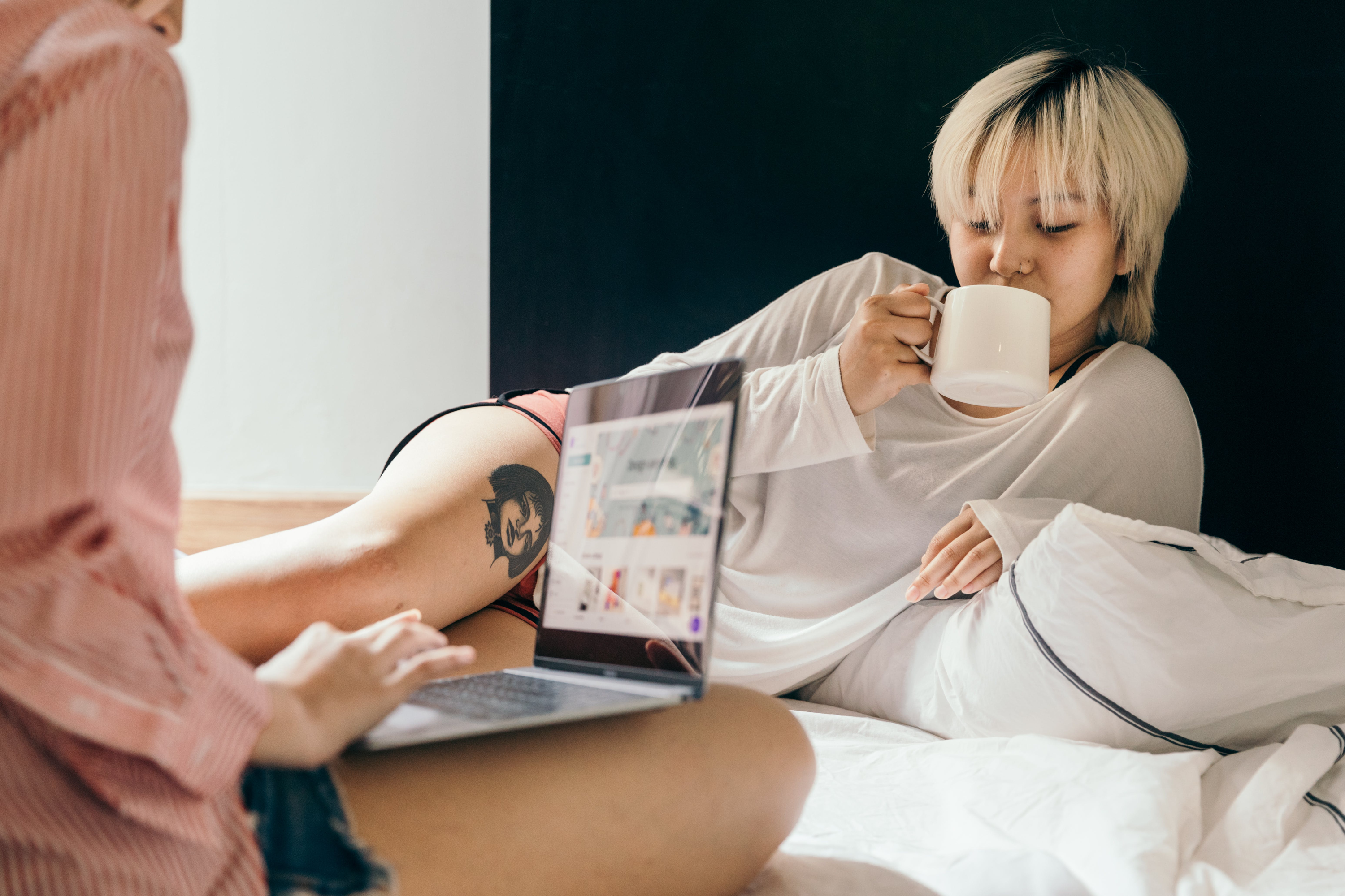 Two women working with laptop