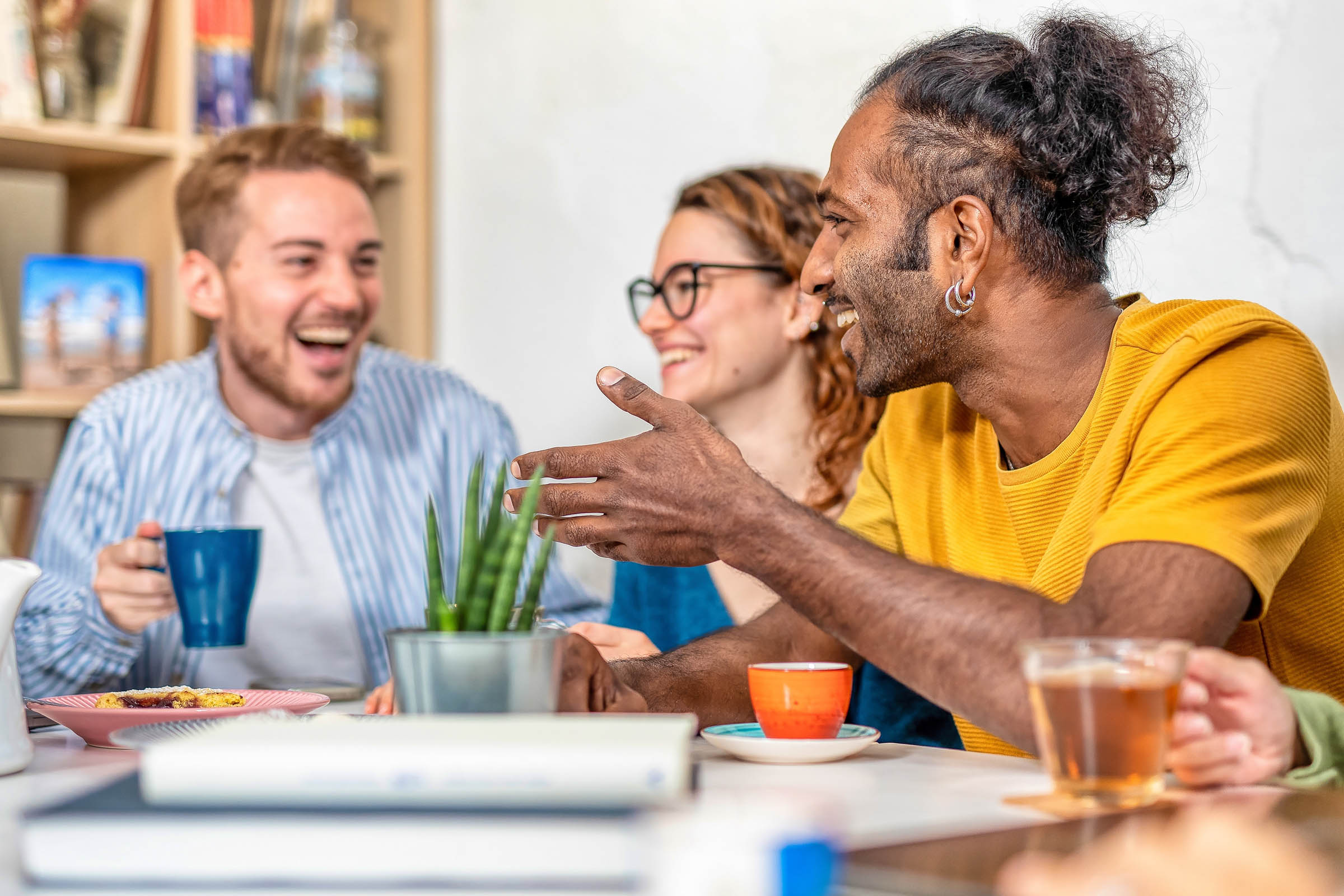 Friends sat around drinking coffee