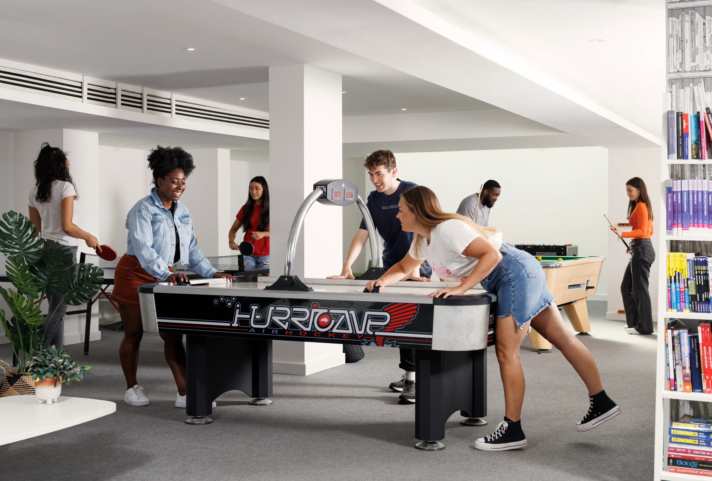 Students in the common room games area