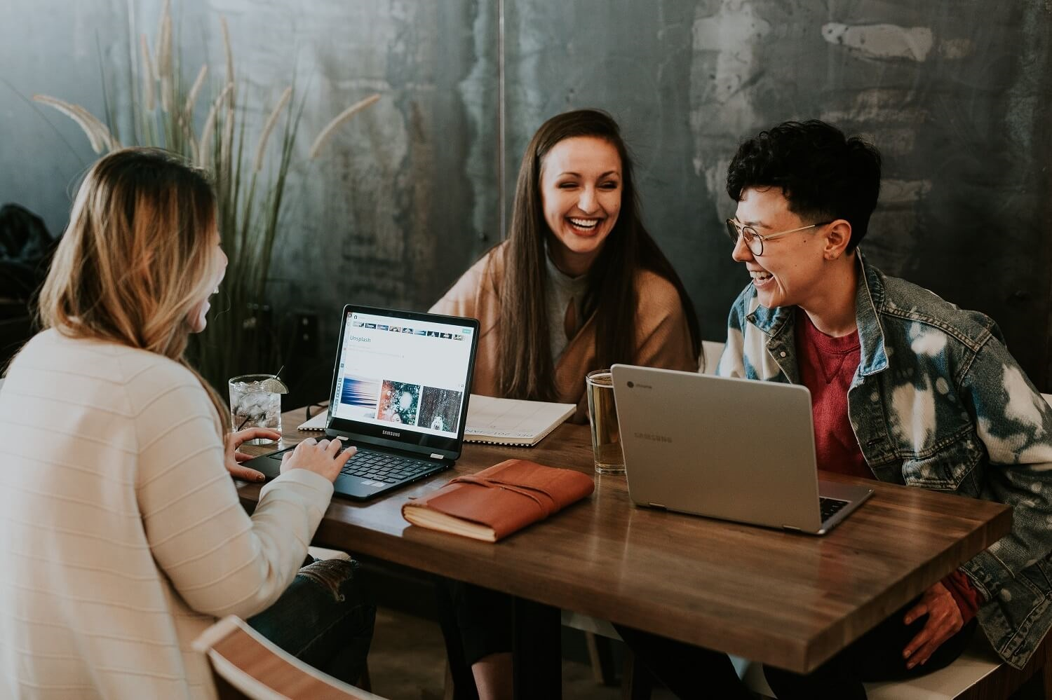 Students at a table with laptops