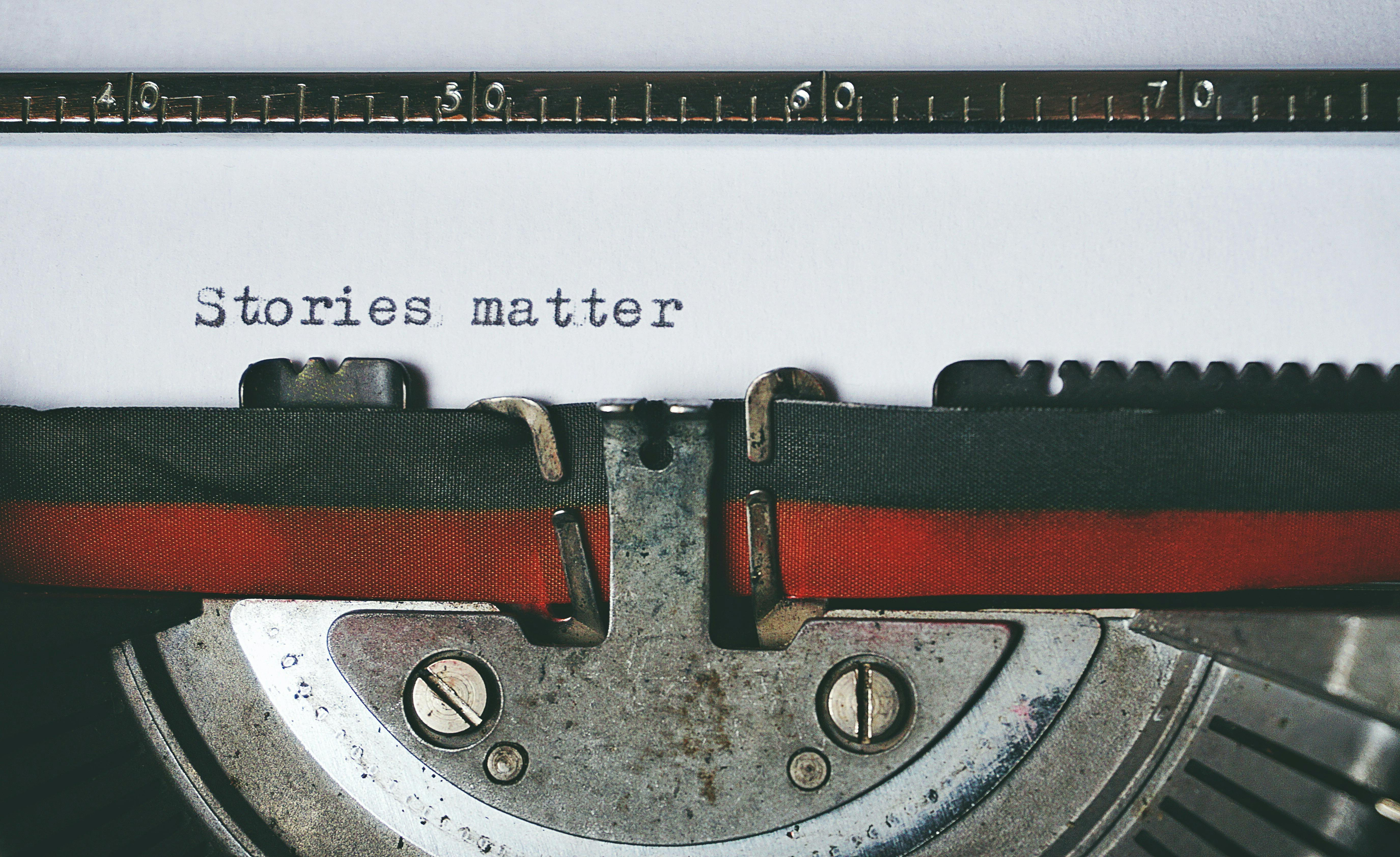 A typewriter with words 'stories matter'