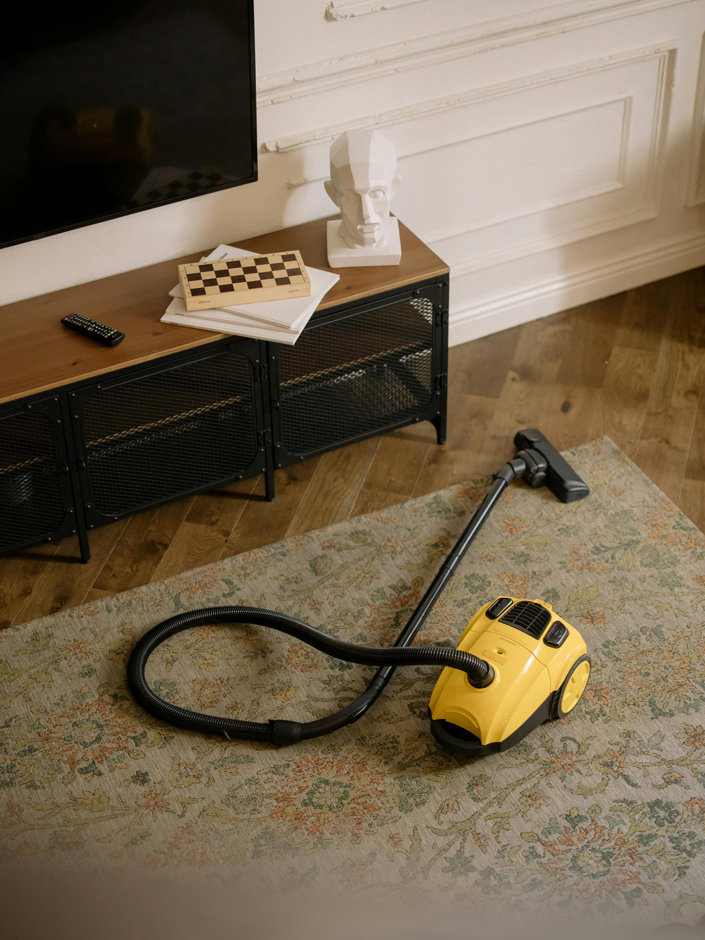 Vaccum cleaner being used in living room