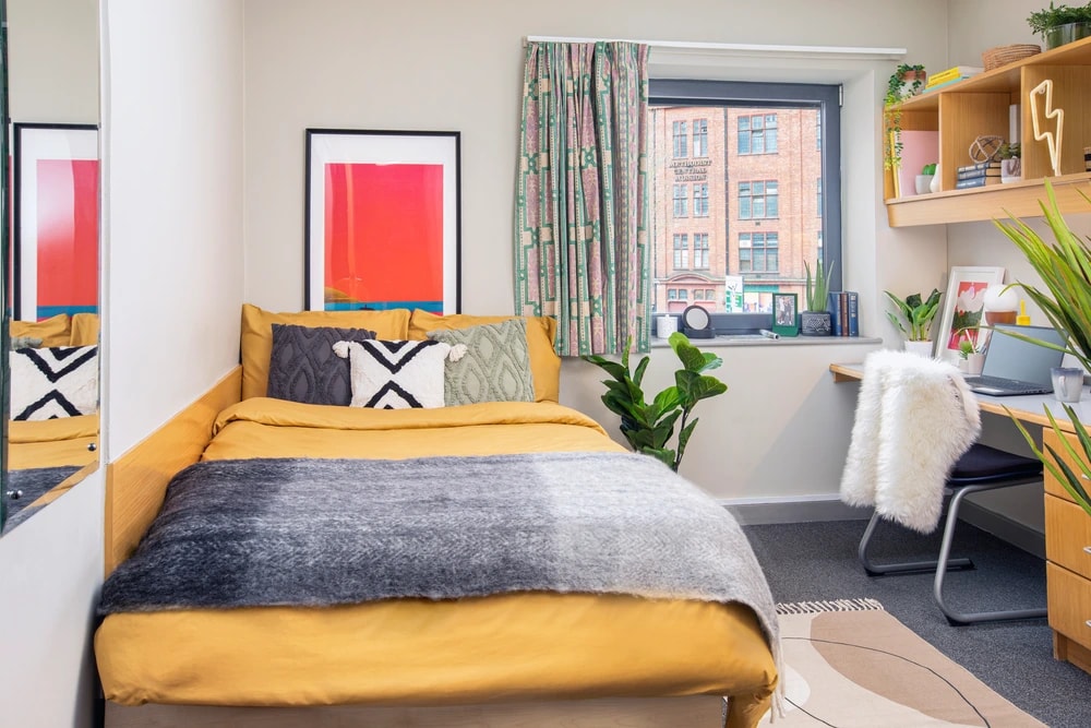 Bed and study space in an En-suite room