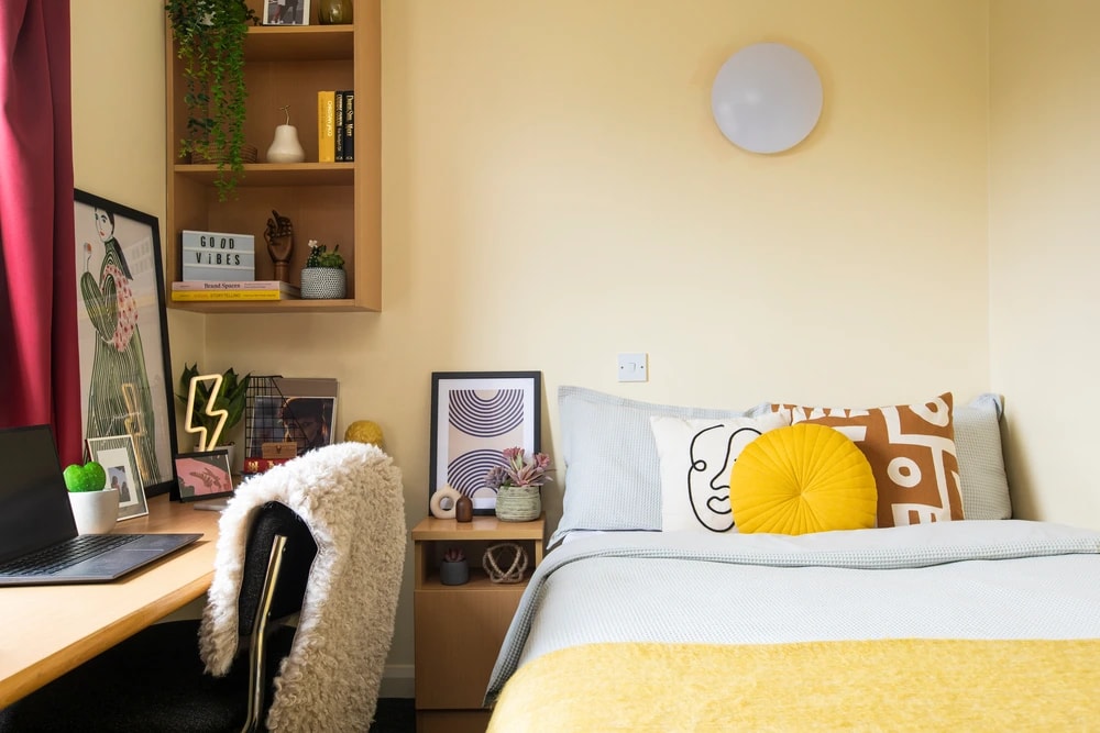 Bed and study space in an En-suite room