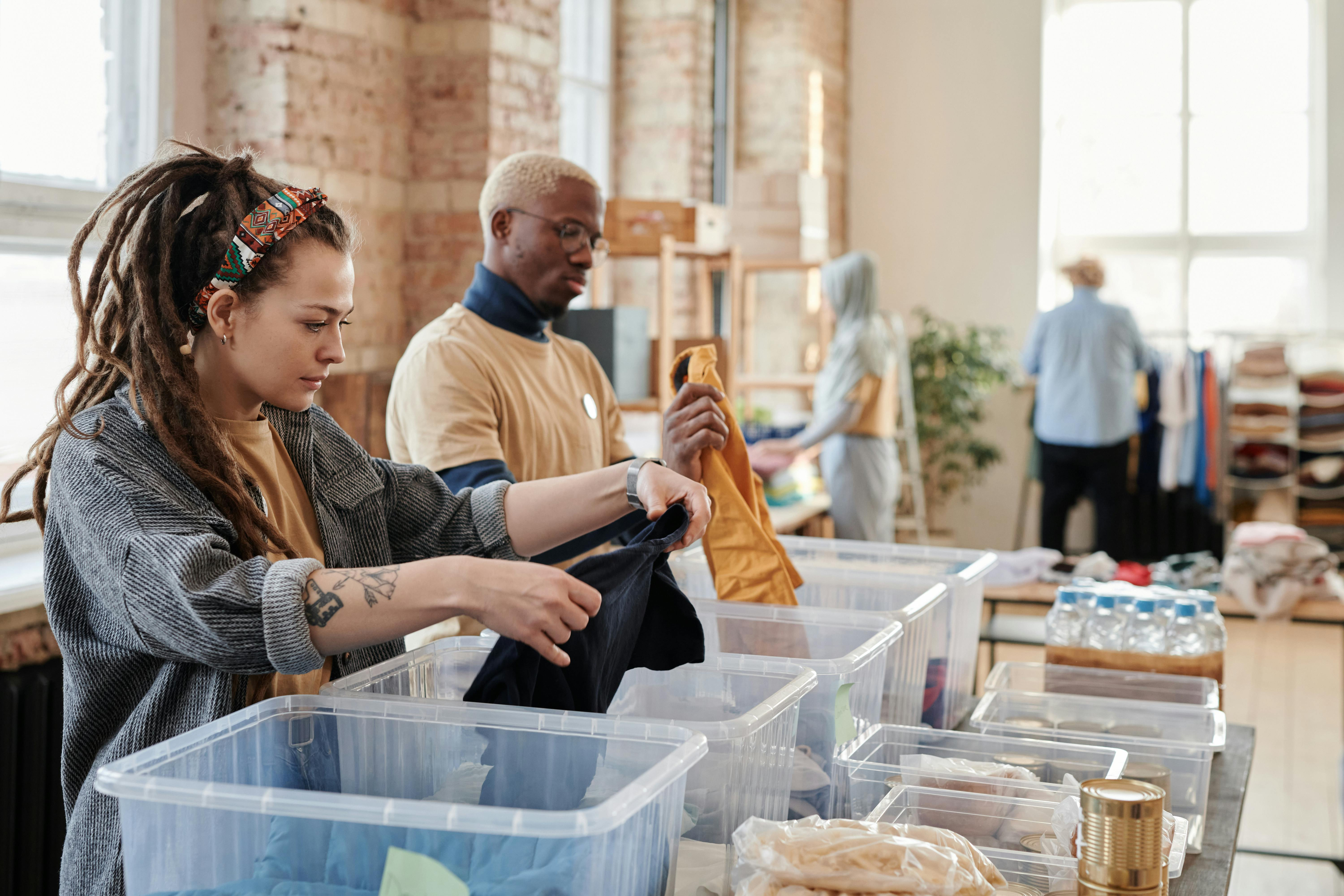 People volunteering and putting food out