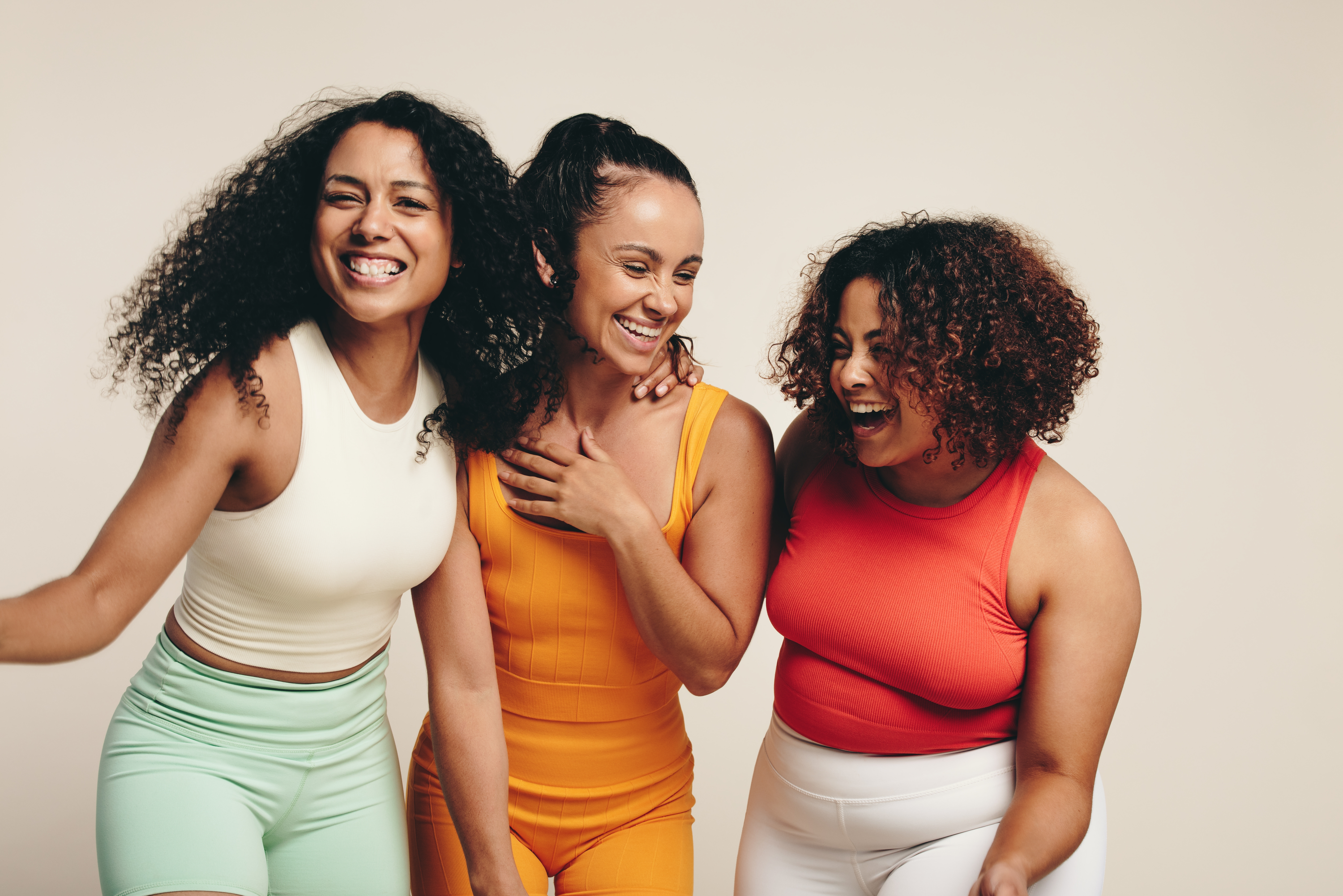 Three women dressed in sportswear